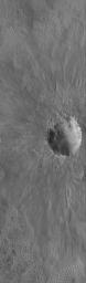 This image from NASA's Mars Global Surveyor shows an impact crater on the martian northern plains. This crater is roughly the size of the famous Meteor Crater in Arizona on the North American continent.