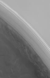 This image from NASA's Mars Global S shows a steep slope in the north polar region of Mars. The stripes indicate an exposure of layered material; the variations in brightness are the result of varying amounts and textures on seasonal carbon dioxide frost.