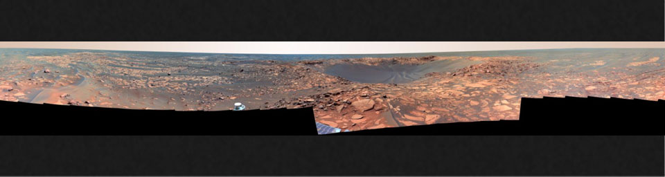 This 360-degree view taken in August, 2006, shows Opportunity's last stop on surface of Meridiani Planum. At center of the mosaic is 'Beagle Crater,' an impact crater. Opportunity's tracks are visible approaching the crater.