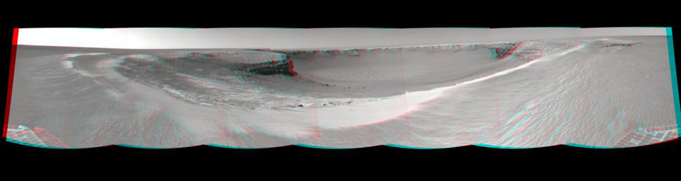 NASA's Mars rover Opportunity edged closer to the top of the 'Duck Bay' alcove along the rim of 'Victoria Crater' (overnight Sept. 27 to Sept. 28), and gained this vista of the crater. 3D glasses are necessary to view this image.