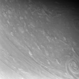 Contorted clouds wriggle across high northern latitudes in this exquisitely detailed close-up of Saturn's atmosphere. This image was taken in visible light with NASA's Cassini spacecraft's narrow-angle camera.