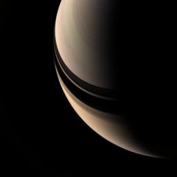 Brooding Saturn seems to be missing its rings, but their shadows on the planet betray their presence. The inner rings are in fact contained within this scene, but they are so tenuous as to be nearly invisible as seen by NASA's Cassini spacecraft.