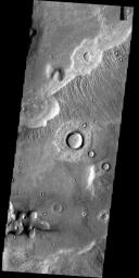 This image from the Deuteronilus Mensae region shows an interesting portion of the martian dichotomy. It appears that the crater in the upper part of the image is being re-exposed after burial on Mars as seen by NASA's Mars Odyssey spacecraft.