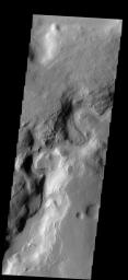 A portion of Auqakuh Vallis on Mars is shown in this image from NASA's 2001 Mars Odyssey spacecraft.