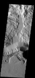 This spectacular image of the northern escarpment of Olympus Mons on Mars contains many different features. Lava flows are visible at the bottom of the frame. This image is from NASA's 2001 Mars Odyssey spacecraft.