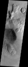 This region of dark sand dunes is located on the floor of an unnamed crater south of Bosporos Planum on Mars as seen by NASA's Mars Odyssey spacecraft.
