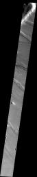 The slope streaks and small, dark landslides are located in Noctus Labyrinthus on Mars as seen by NASA's Mars Odyssey spacecraft.
