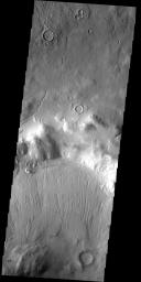 This grouping of three crater on Mars looks like Mickey Mouse as seen by NASA's Mars Odyssey spacecraft.