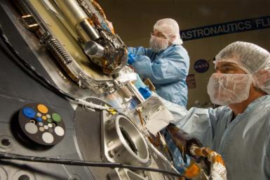 Lockheed Martin Space Systems technicians work on the science deck of NASA's Phoenix Mars Lander.