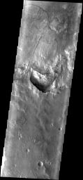 This image from NASA's Mars Odyssey spacecraft shows a large landslide on Mars, located within an unnamed crater to the WSW of Holden Crater.
