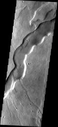 This image from NASA's Mars Odyssey spacecraft shows a broad channel located on the flank of Tyrrhena Patera, an old volcano in the southern hemisphere of Mars.