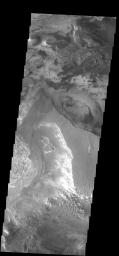 This image from NASA's Mars Odyssey spacecraft shows a small portion of the floor of Candor Chasma, part of Vallis Marineris. Different layers and textures are evident in this image.