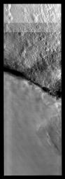 This image from NASA's Mars Odyssey spacecraft shows the border between clear and cloudy that is likely the edge of a polar trough on Mars, with the clouds located in the trough itself.