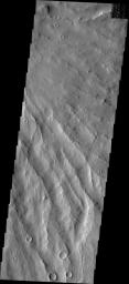 This image from NASA's Mars Odyssey spacecraft shows the eroded southeastern flank of Apollinaris Patera, an old volcano on Mars that has undergone extensive erosion. 