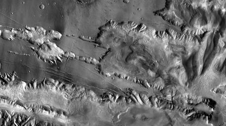 This image from NASA's Mars Odyssey spacecraft shows the southwestern portion of Mars's Candor Chasma, part of the large canyon system named Valles Marineris on Mars.