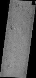 This image from NASA's Mars Odyssey shows a region on Mars near the highland/lowland boundary appears to be breaking into curved-edged blocks. Block edges are created by arcs of collapse pits which expand until a complete margin is created.