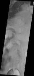 This image from NASA's Mars Odyssey shows sand dunes located in the mountains at the margin of the Argyre Basin.