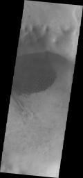 This image from NASA's Mars Odyssey shows a small unnamed crater southwest of Kuiper Crater. The dunes in this image are completely free of frost.