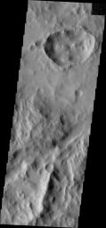 This image from NASA's Mars Odyssey shows dark streaks present on the interior rim of this unusual crater within Tikhonravov Crater.