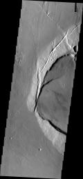 This image from NASA's Mars Odyssey shows Jovis Tholus, a small volcano in the Tharsis region of Mars. The western part of the volcano has collapsed.