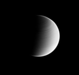 This view of Titan captured by NASA's Cassini spacecraft shows banding in the atmosphere of the moon's northern hemisphere. Like the planet Venus, Titan's atmosphere rotates faster than its surface, a characteristic called 'super rotation.'
