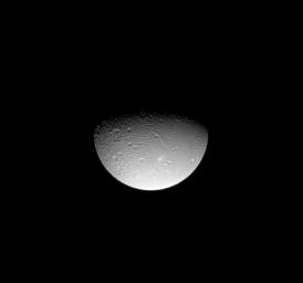 NASA's Cassini spacecraft gazes down at linear tectonic features in Saturn's moon Dione's northern hemisphere. This image was taken in visible light with the Cassini spacecraft narrow-angle camera on Aug. 3, 2008.