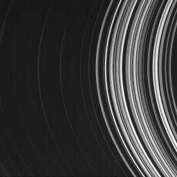 Saturn's B ring is filled with radial structure. This image from NASA's Cassini spacecraft of the inner B ring was taken from the unlit side of the rings so the denser parts of the ring transmit less light and consequently appear darker here.
