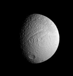 NASA's Cassini spacecraft provides a view of the southern portion of Tethys' trailing hemisphere. Prominent features include the huge canyon, Ithaca Chasma, as well as Demodocus and Telemus, large basins just to the right of the rift.