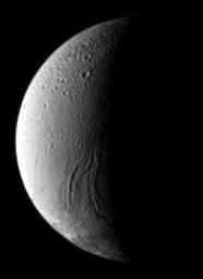 In the boundary between light and shadow on Saturn's moon Enceladus, run the Anbar Fossae a series of narrow, shallow depressions. This image was taken by NASA's Cassini spacecraft's narrow-angle camera on Dec. 17, 2008.