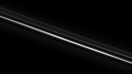 Saturn's F ring, which often appears kinked and gored, looks straight here. Above the brighter core, the ghostly strands of the F ring's outer envelope, with a spiral arm structure, appear in this image taken by NASA's Cassini spacecraft on Nov. 8, 2008.