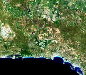 The Nard Ring is a striking visual feature from space, and astronauts have photographed it several times. The Ring is a race car test track in Italy. This image was acquired by NASA's Terra satellite on August 17. 2007.