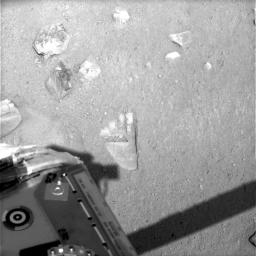 NASA's Phoenix Mars Lander shows the first impression, dubbed Yeti and looking like a wide footprint, made on the martian soil by the robotic arm scoop on May 31, 2008.