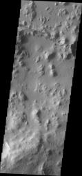 This image from NASA's Mars Odyssey shows Tartarus Montes, a group of low hills located between Orcus Patera and the Elysium volcanic region. Many fractures cut the Tartarus Montes running radial to the Elysium volcanic center.