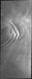 This image from NASA's Mars Odyssey shows clouds close enough to the martian surface to be affected by this crater.