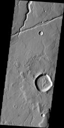 This image from NASA's Mars Odyssey shows Tempe Terra containing northward flowing channels and a graben running ENE to WSW. The intersection of the large channel and the graben shows that the fracturing that created the graben postdates the channel.