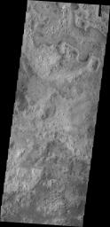 This image from NASA's Mars Odyssey shows northern plains of Mars with little topographic variation. The surfaces textures very greatly from one region to the next. The cause of such variation is unknown.