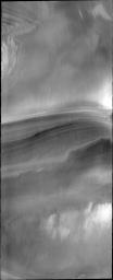 This image from NASA's Mars Odyssey shows the north pole of Mars with a cross-section through the ice. The layering is thought to relate to seasonal deposition of summer dust and winter ice.