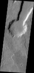 This image from NASA's Mars Odyssey shows an unnamed crater in Arabia Terra on Mars appearing to be the source of the channel that runs to the top of the frame. This channel/crater combination is part of a much larger channel system in Arabia Terra.