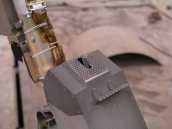 This close-up photograph taken at the Payload Interoperability Testbed at the University of Arizona, Tucson, shows the motorized rasp protruding from the bottom of the scoop on the engineering model of NASA's Phoenix Mars Lander's Robotic Arm.