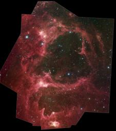 Generations of stars can be seen in this new infrared portrait from NASA's Spitzer Space Telescope. In this wispy star-forming region, called W5, the oldest stars can be seen as blue dots in the centers of the two hollow cavities.