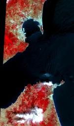 This image acquired by NASA's Terra satellite on July 5, 2000 covers the eastern part of the Strait of Gibraltar, separating Spain from Morocco. The promontory on the eastern side of the conspicuous Spanish port is the Rock of Gibraltar.