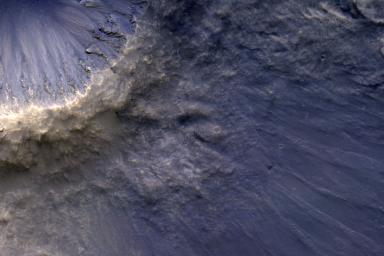 NASA's Mars Reconnaissance Orbiter captured this image of impact ejecta, a material that is thrown up and out of the surface of a planet as a result of the impact of an meteorite, asteroid or comet.