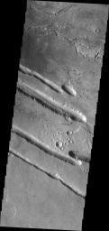 This image from NASA's Mars Odyssey shows fracturing and collapse related to the Elysium Volcanic Complex on Mars.
