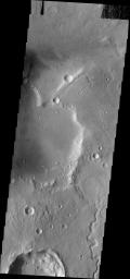 This image from NASA's Mars Odyssey shows an unnamed channel in Arabia Terra emptying into an unnamed crater and creating a delta formation.