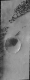 This image from NASA's Mars Odyssey shows polar dunes on Mars occurring on the plains and within the unnamed crater on Mars.