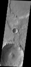 Two landslides are located on the rim of this unnamed crater in Tyrrhena Terra on Mars as seen by NASA's Mars Odyssey spacecraft.