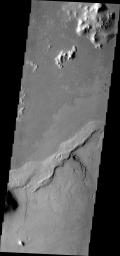 This image from NASA's Mars Odyssey shows a volcanic vent and related flows located in Elysium Planitia.