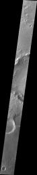 This image from NASA's Mars Odyssey shows a large landslide located in an unnamed crater southwest of Holden Crater.