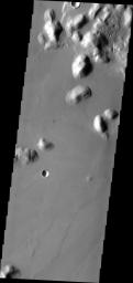 This image from NASA's Mars Odyssey shows hills within Marte Vallis, a large volcanic flow.