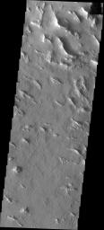 This image from NASA's Mars Odyssey shows wavy linear ridges in Gigas Sulci that are actually dunes. These dunes are probably very old and not active at the present time.